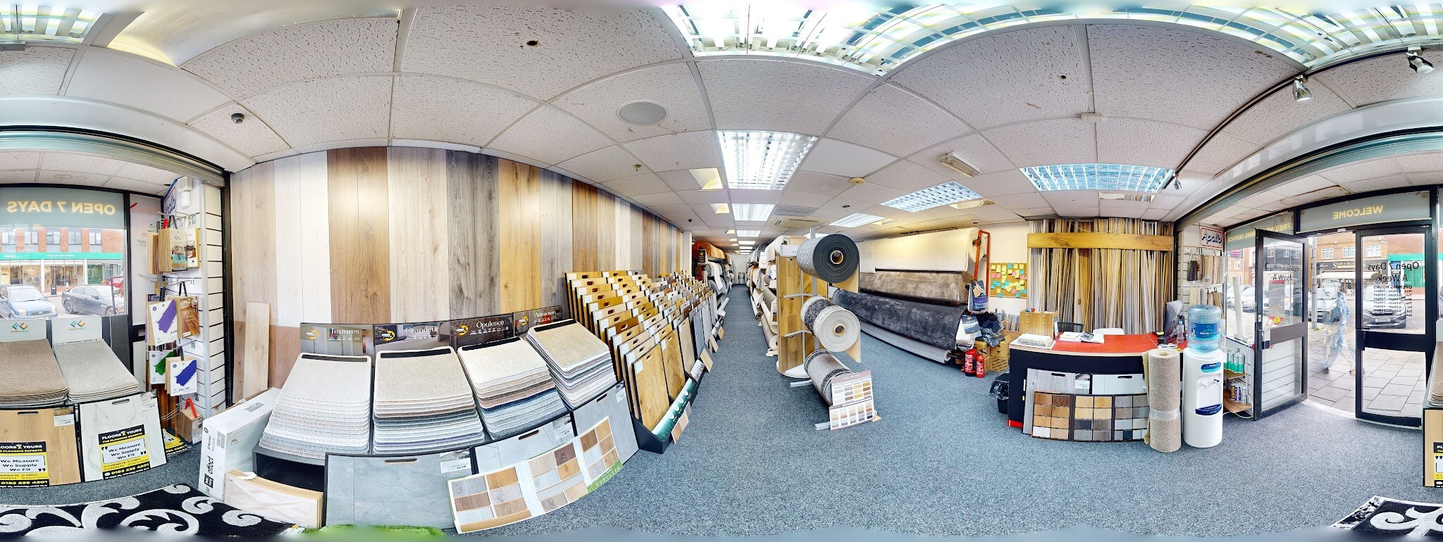 Panoramic view across carpet and flooring displays inside the Aldridge showroom